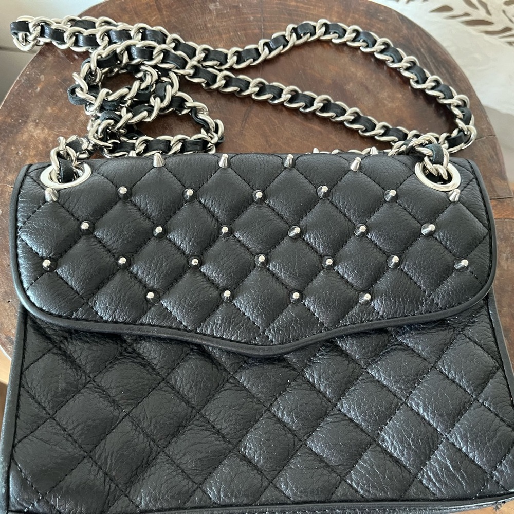 Rebecca Minkoff black cross body with studded accent.